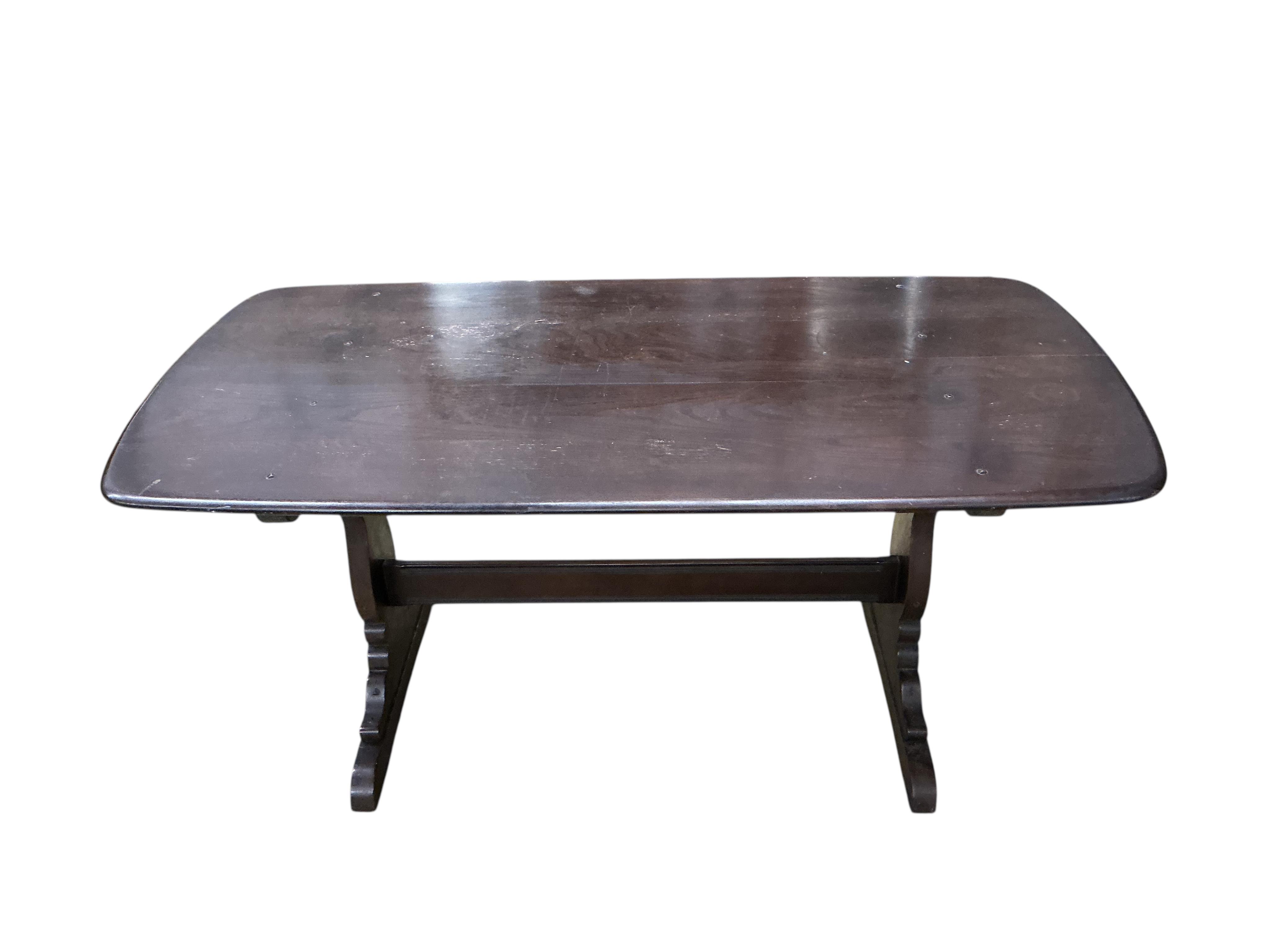An Ercol dark elm rectangular dining table, width 150cm, depth 77cm, height 72cm and four Ercol chairs